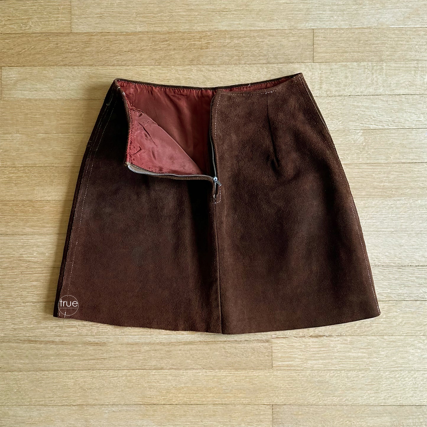 vintage 1960's suede mini skirt ...woodstock era chocolate leather suede topstitched circle pockets w/brass o-ring zippers